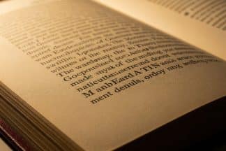 A close-up of a classic book page showing the elegant serif font typography